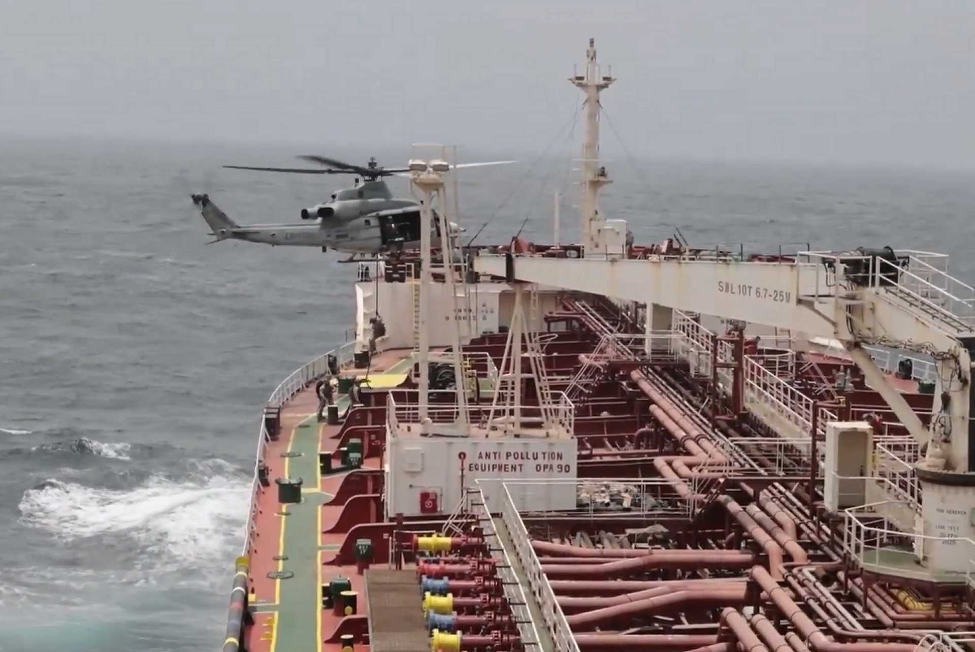 U.S. Navy conducts a verification boarding during a maritime interdiction operation in the Gulf of Oman as part of the enforcement of the U.S. naval blockade against Iran.