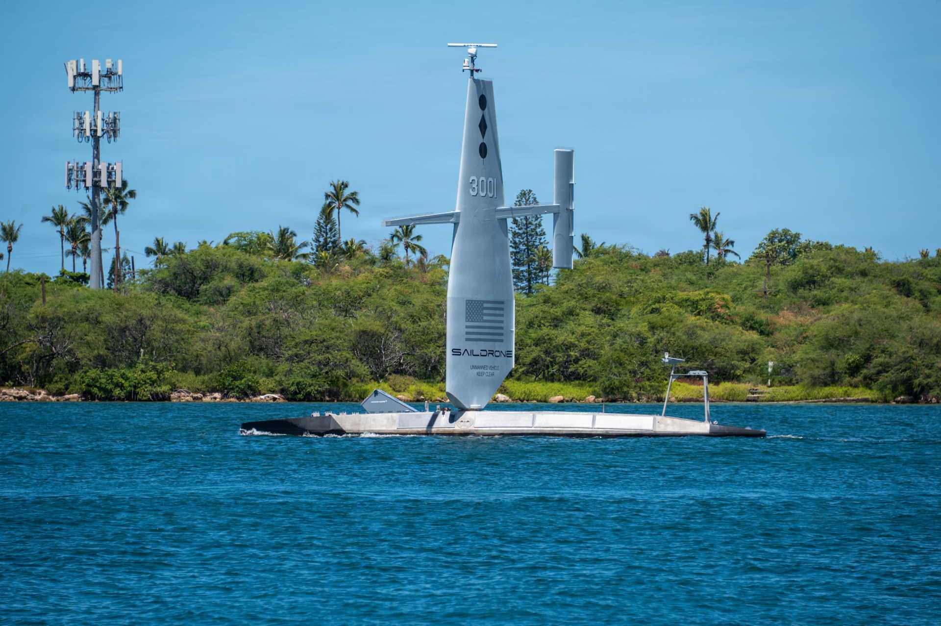 The U.S. Navy's Saildrone Surveyor (SD-3001) uncrewed surface vessel departs Joint Base Pearl Harbor-Hickam, Hawaii, on July 8, 2026, to participate in Exercise Rim of the Pacific (RIMPAC) 2026, demonstrating the Navy's expanding use of autonomous maritime systems to strengthen persistent surveillance and distributed maritime operations.