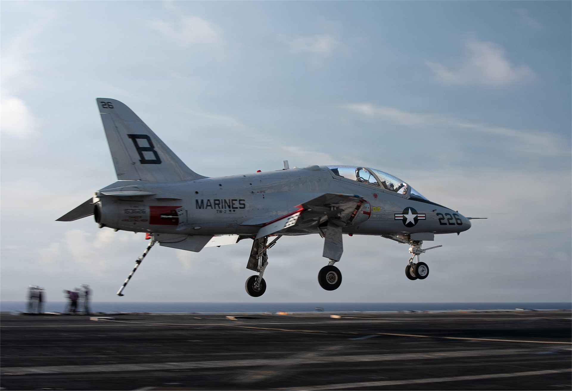 A U.S. Navy T-45C Goshawk advanced jet trainer approaches the flight deck of the Nimitz-class aircraft carrier USS Dwight D. Eisenhower (CVN 69) during carrier qualification operations in the Atlantic Ocean on June 27, 2026. (Picture source: U.S. Department of War/Defense)