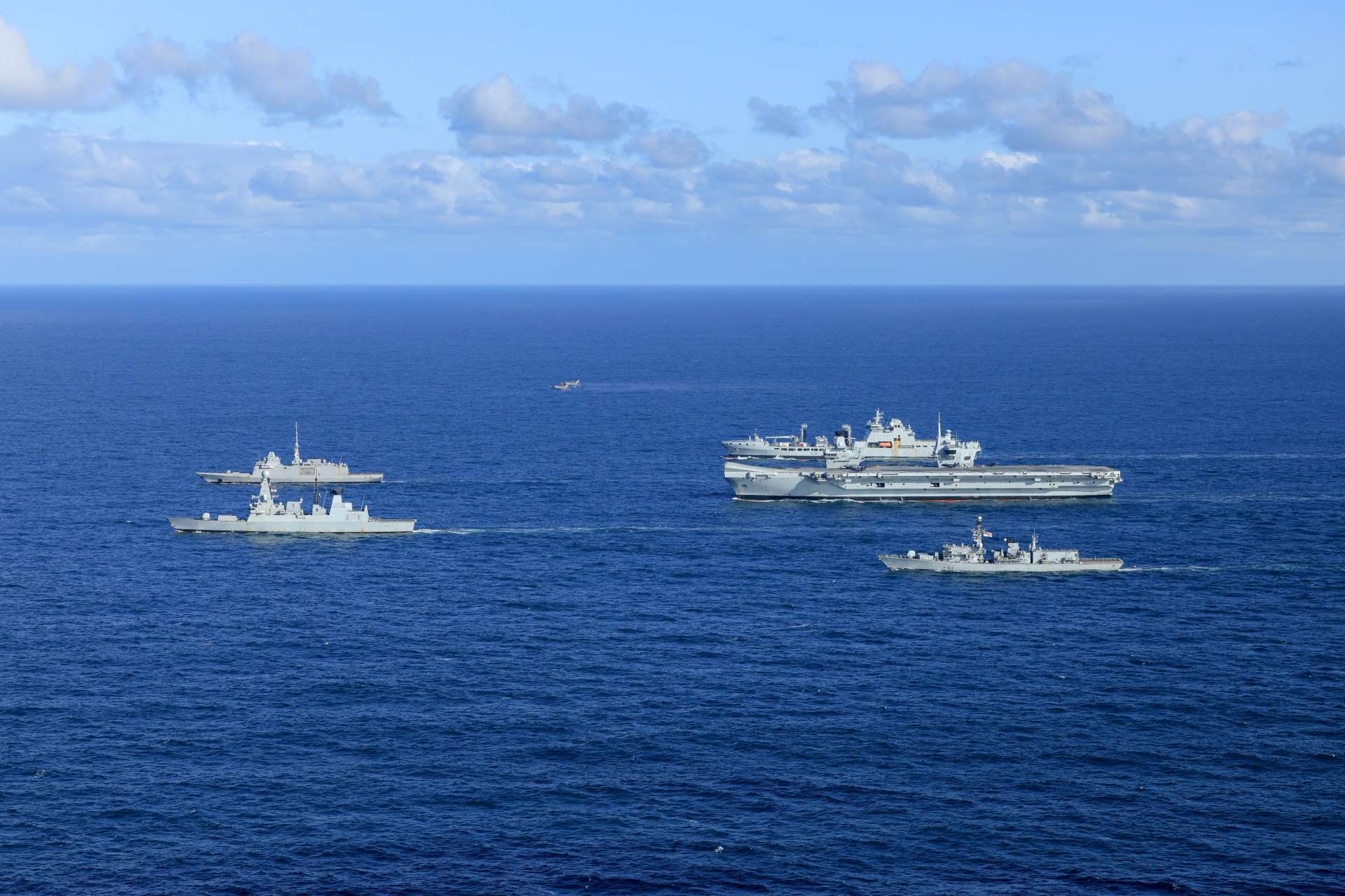 HMS Prince of Wales leads a NATO carrier strike group during Neptune Strike 26-3 in the High North, combining F-35B fighters, air-defence destroyers, anti-submarine frigates and support ships to test readiness, deterrence and multinational interoperability (Picture source: UK Royal Navy).