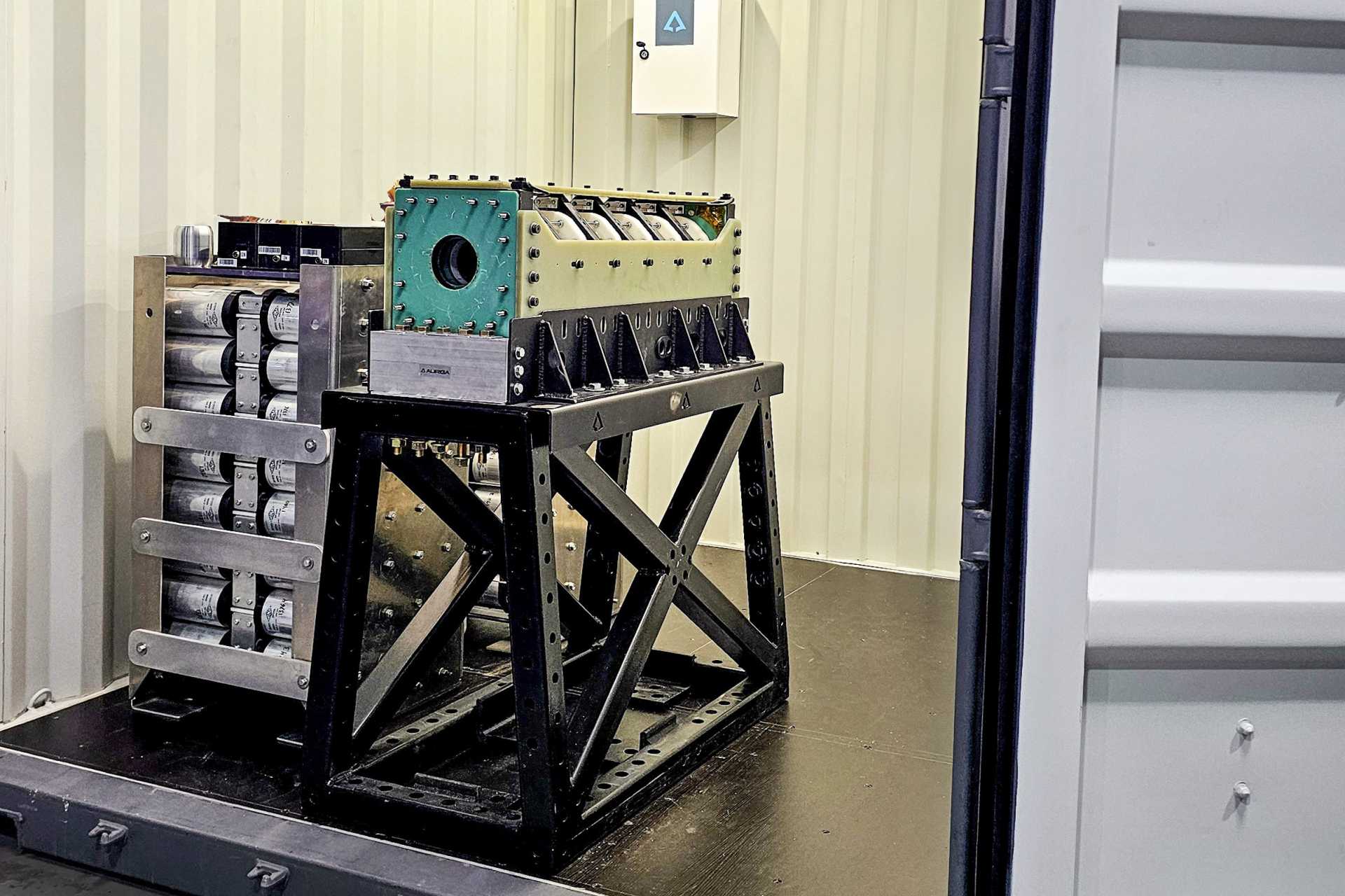 In conventional guns, the expanding gas creates enough pressure behind a projectile to force it through a barrel, while the electromagnetic accelerator uses controlled magnetic forces to accelerate a projectile along the launcher. (Picture source: Auriga Space)