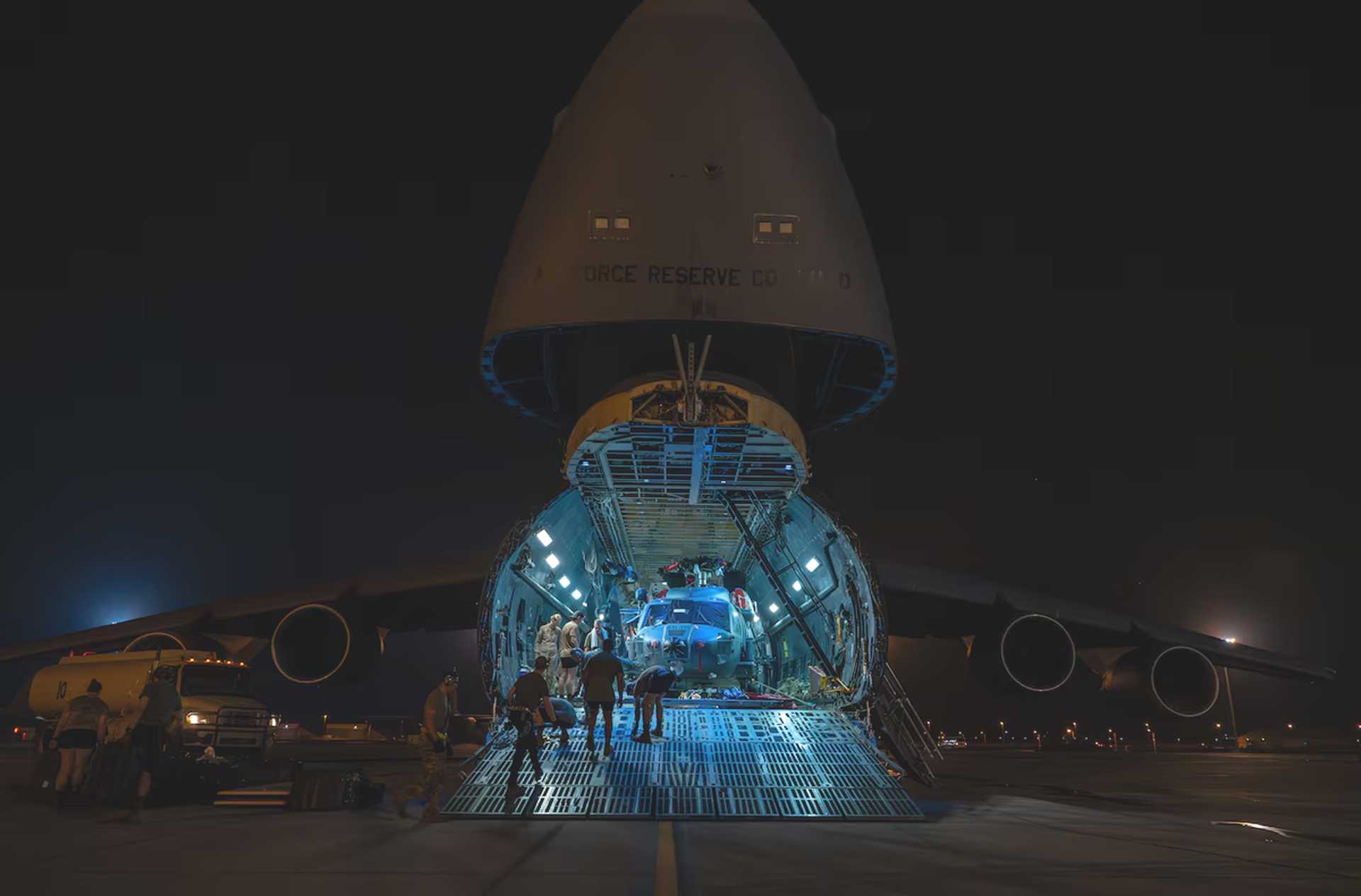 A U.S. Air Force HH-60W Jolly Green II is unloaded from a C-5 Super Galaxy at Camp Lemonnier, Djibouti, on June 10, 2026, marking its deployment to support combat rescue and crisis response missions in East Africa.