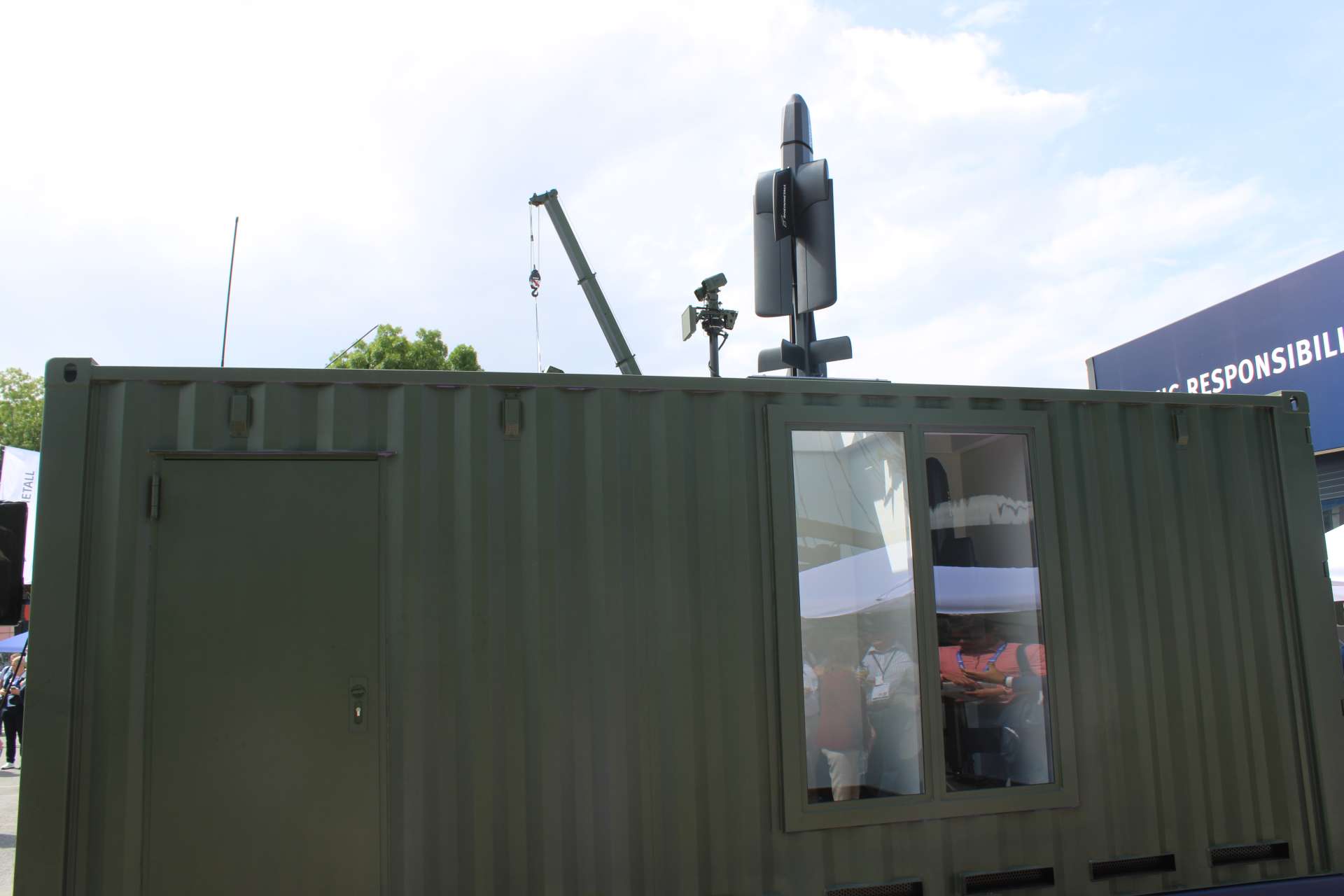 Rheinmetall’s Containerized Missile Launcher for the FV-014 Loitering Munition System can carry up to 18 munitions in a 20-foot container, enabling remote, dispersed salvo launches for reconnaissance, target tracking, and precision strikes at ranges of up to 100 km (Picture source: Army Recognition Group).