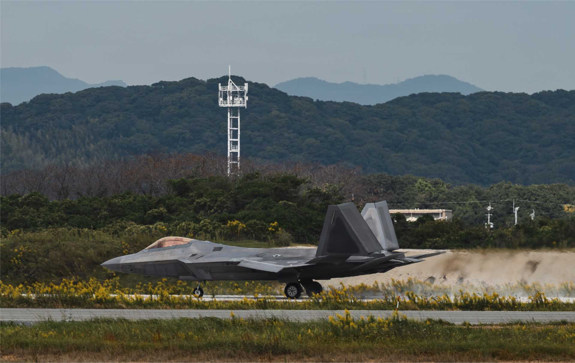 A U.S. Air Force F-22 Raptor from the 525th Expeditionary Fighter Squadron, deployed from Joint Base Elmendorf-Richardson, Alaska, lands at Tsuiki Air Base, Japan, during Exercise Keen Sword 27 on October 19, 2026. The deployment expands operating options for U.S. stealth fighters beyond Kadena. (Picture source: U.S. Department of War/Defense)