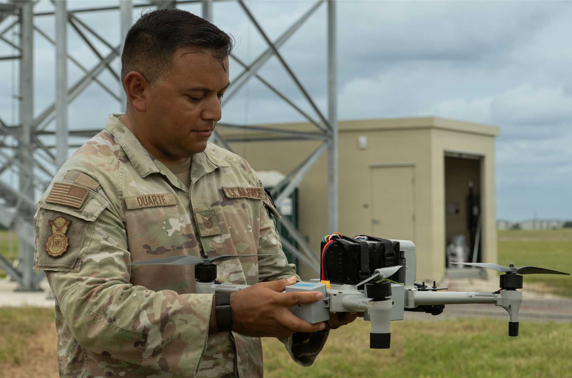 U.S. Air Force Tech. Sgt. Nathan A. Duarte, 6th Security Forces Squadron unmanned aircraft systems program manager, inspects a Bumblebee V2 drone interceptor during counter-drone training at MacDill Air Force Base, Florida.