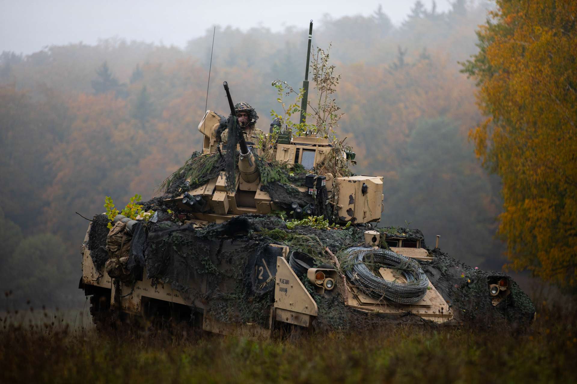 A U.S. Army M2 Bradley engages a simulated enemy at Hohenfels, highlighting NATO’s focus on armored interoperability and high-intensity warfare readiness (Picture Source: U.S. Army)