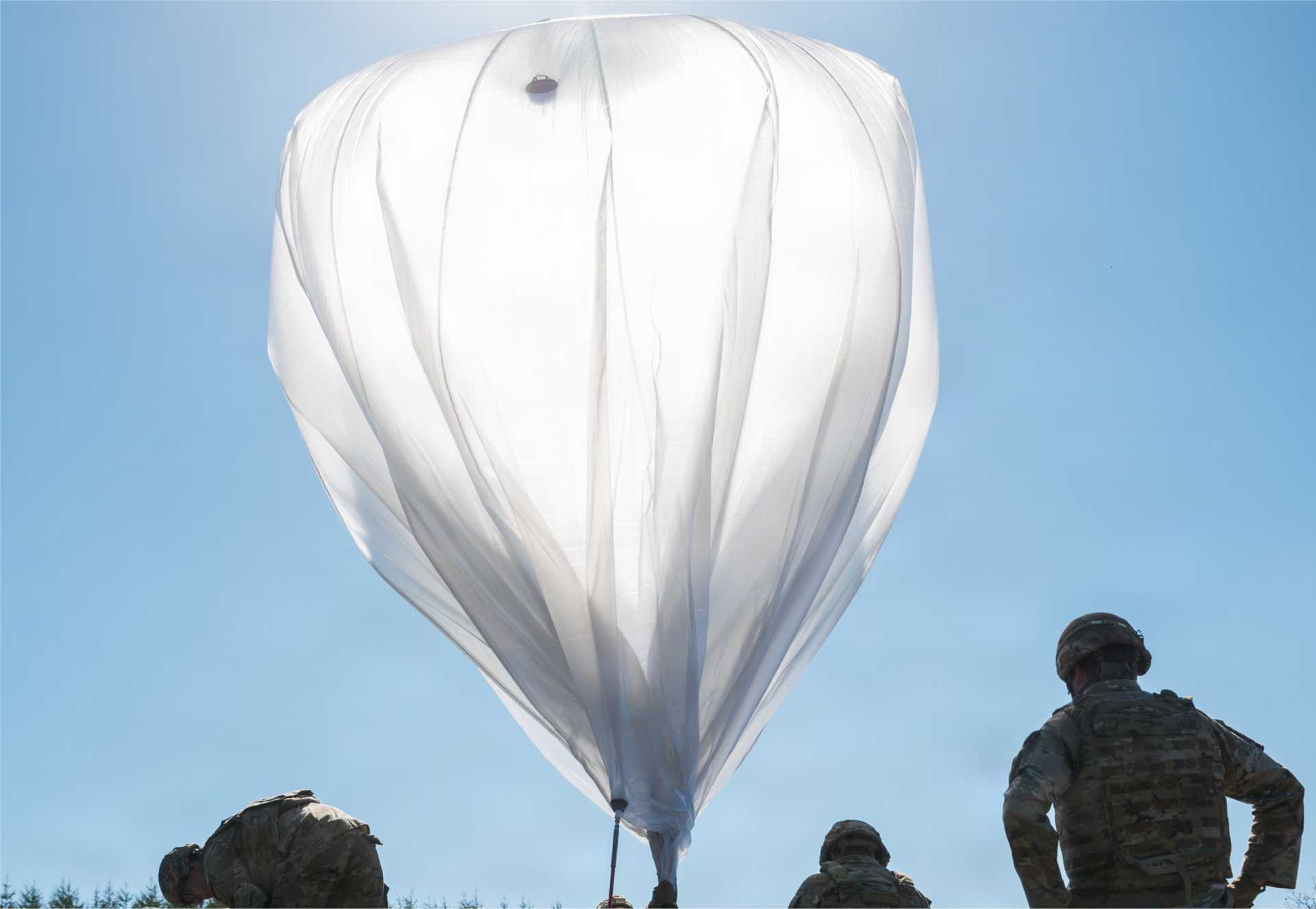 U.S. Army Soldiers prepare to launch a helium-filled micro-High-Altitude Balloon at the Yausubetsu Training Area in Hokkaido, Japan, during Exercise Orient Shield 2026 on September 18, 2026, demonstrating the use of high-altitude systems for persistent sensing, communications, and other operational missions.