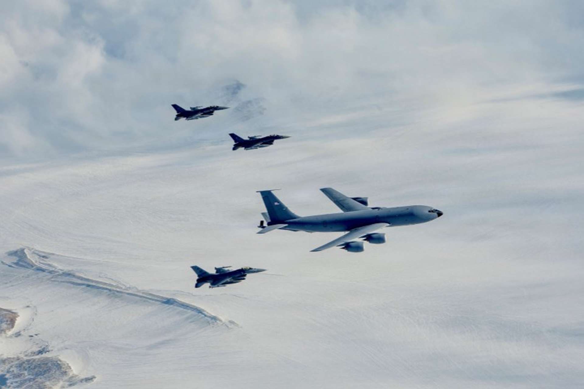 NORAD deployed U.S. Air Force F-16 Fighting Falcons from Alaska through Canada toward Greenland to test rapid fighter deployment, aerial refueling and sustained combat operations across the Arctic. (Picture Source: NORAD)