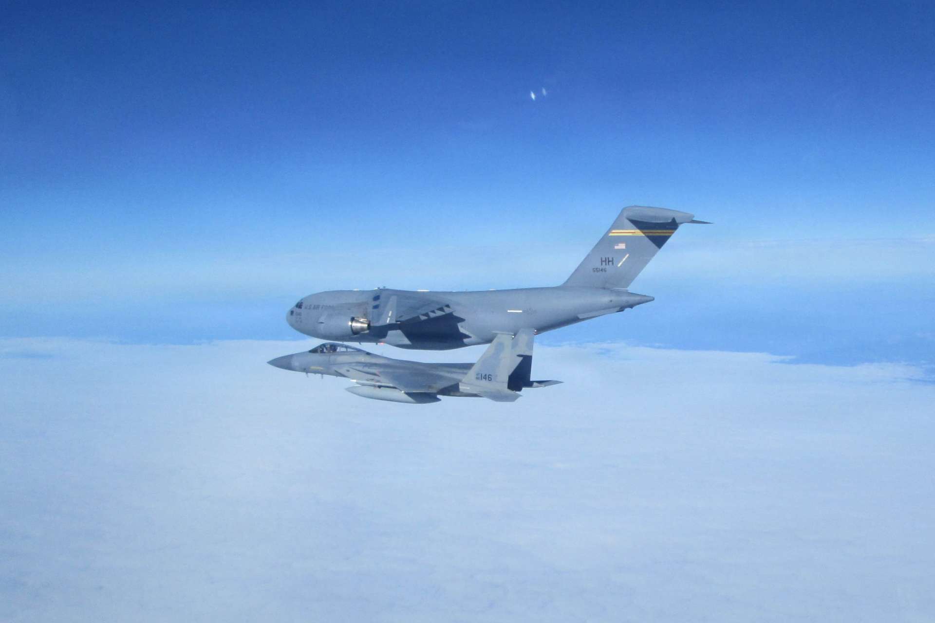 An Air National Guard F-15C Eagle rehearsed a long-range interception of a C-17 during AMALGAM DART 2026, testing NORAD’s ability to defend protected North American airspace (Picture Source: U.S. Air Force)