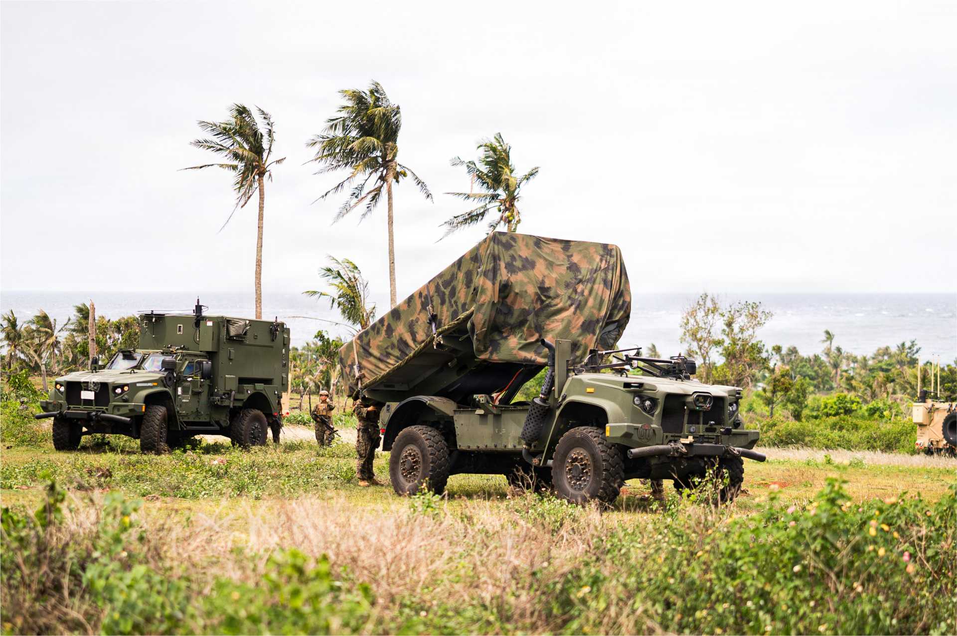 U.S. Marines operate an NMESIS battery equipped with Naval Strike Missile launchers during expeditionary training. The mobile anti-ship missile system is designed to support distributed sea-denial missions from dispersed coastal positions across the Indo-Pacific.