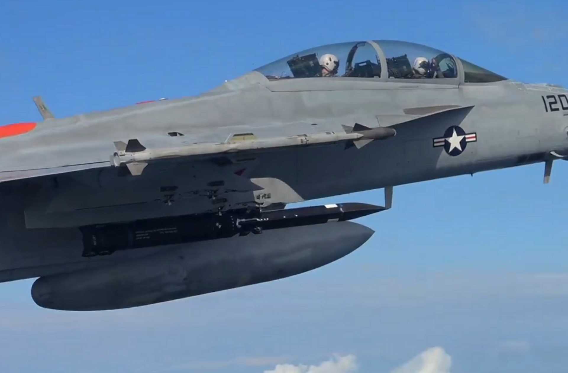Screenshot from a NAVAIR video released on September 25, 2026, showing a U.S. Navy F/A-18E/F Super Hornet carrying a Blackbeard hypersonic strike missile beneath its wing during flight testing.