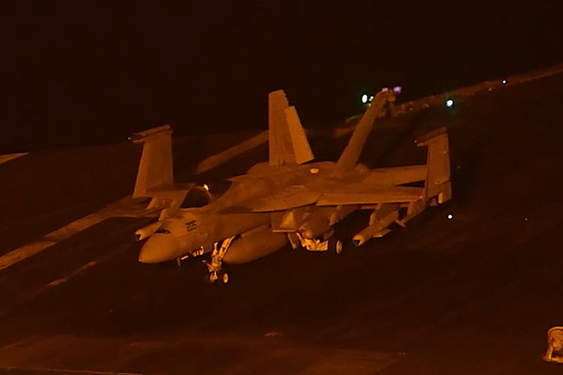 U.S. Navy imagery shows an F/A-18E Super Hornet aboard USS George Washington apparently carrying two SLAM-ER-family missiles, underscoring the carrier air wing’s long-range precision-strike capability in the U.S. 5th Fleet area (Picture Source: U.S. Navy)