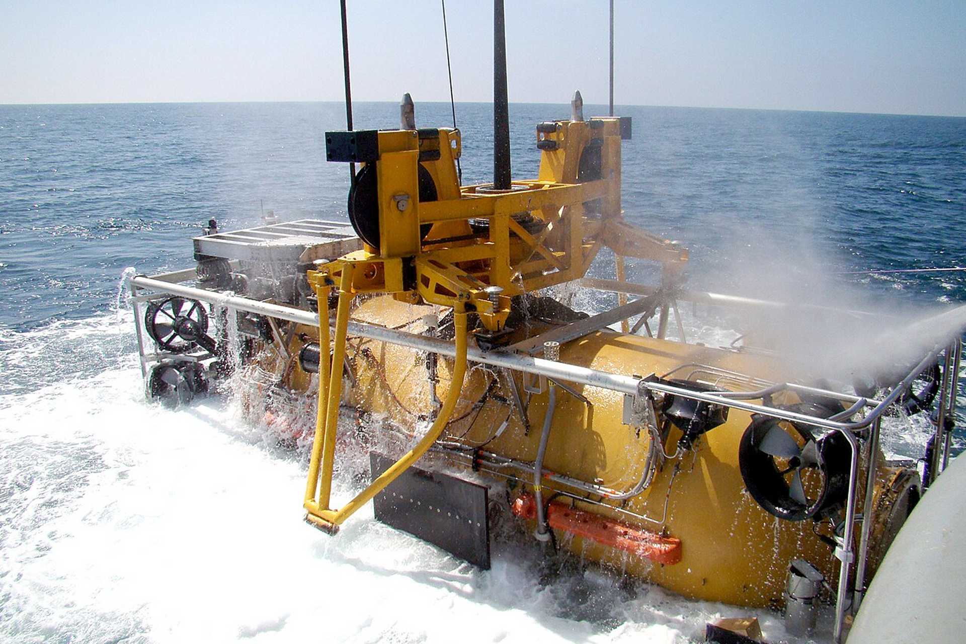 At the heart of the Submarine Rescue Diving Recompression System (SRDRS) is the PRM-1 Falcon, a tethered, remotely operated rescue vehicle that can dive down to 2,000 feet (610 meters), mate with a submarine hatch at angles up to 45 degrees, and rescue up to 16 personnel per trip. (Picture source: US Navy)