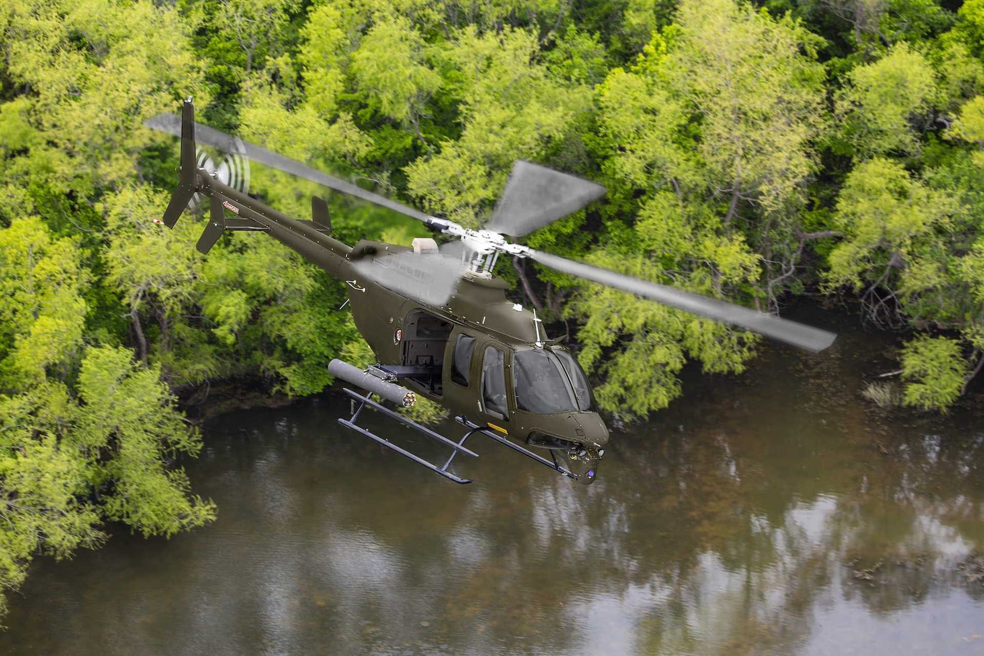 The Bell 407M is a light armed reconnaissance helicopter capable of detecting, identifying, tracking, and engaging ground targets by day or night using EO/IR sensors, machine guns, and 70 mm rockets. (Picture source: Bell)
