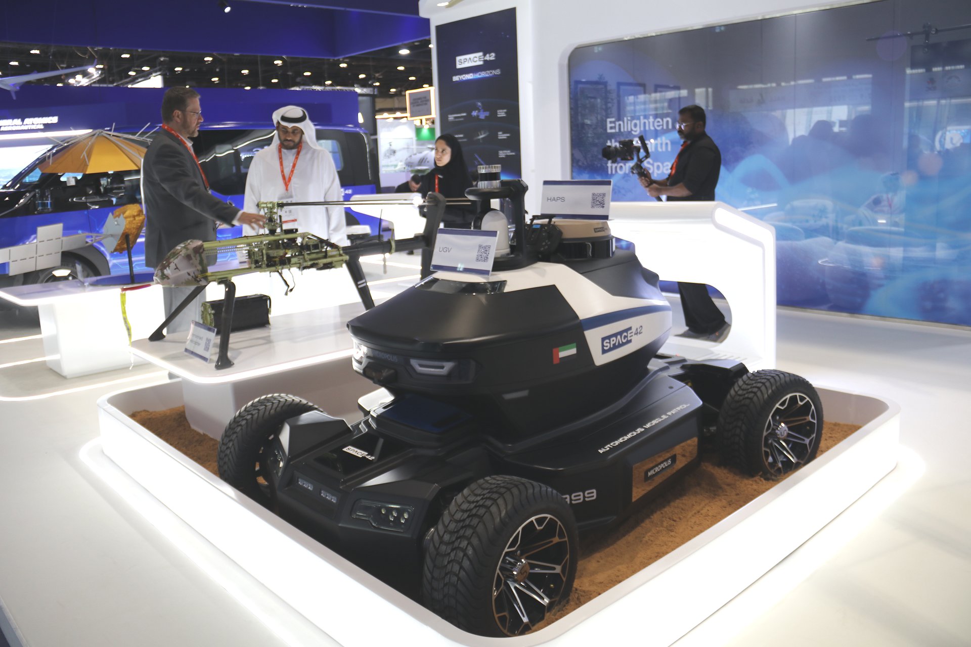 The newly unveiled AI-powered Unmanned Ground Vehicle (UGV) on display at the Space42 booth during UMEX 2026 in Abu Dhabi, showcasing its advanced sensor suite, rugged all-terrain chassis, and Satcom control antenna system designed for autonomous military and security missions.