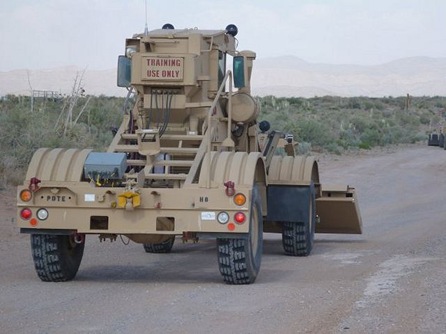 Husky acts as the prime mover for the full width mine proofing/detonation trailers and redpack. It can also serve as an alternate detection vehicle with two detector panels that raise and lower depending on terrain. Additional detection and protection improvements are being incorporated into the system in response to the changing threat and technology advances.