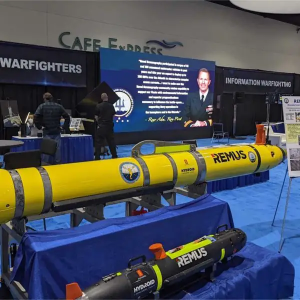 The U.S. Naval Oceanography booth displays Remote Environmental Measuring Units (REMUS) unmanned underwater vehicles (UUVs), designed to support autonomous undersea missions including oceanographic survey, environmental data collection, reconnaissance, and mine countermeasures.