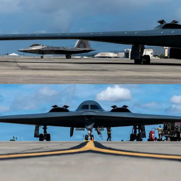 Two U.S. Air Force B-2 Spirit bombers and F-22 Raptor fighters conduct integrated operations at Joint Base Pearl Harbor-Hickam on July 1, 2026, combining long-range stealth strike, air superiority and forward sortie-generation capabilities for Indo-Pacific missions (Picture source: U.S. DoW).