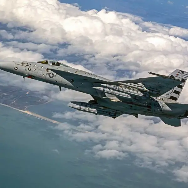 Four AIM-424 Long Range Air-to-Air Missiles are loaded onto a U.S. Navy F/A-18E Super Hornet for testing. The next-generation missile is designed to extend the engagement range, lethality, and defensive reach of Navy and Marine Corps aviation against advanced airborne threats.