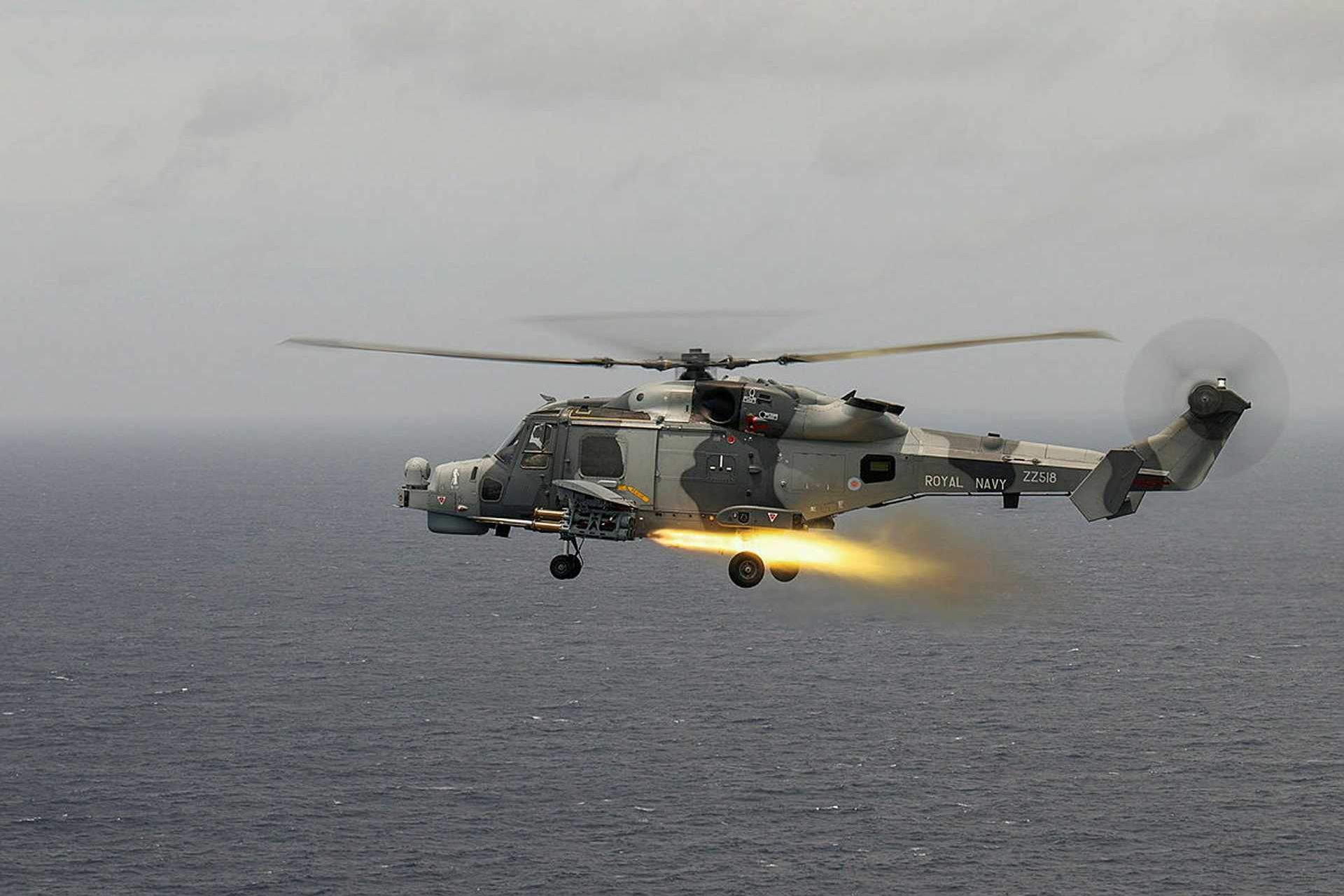 British Royal Navy AW159 Wildcat helicopter fires a Martlet (LMM) missile during a live-fire exercise, showcasing its precision strike capability and multi-role weapon integration.