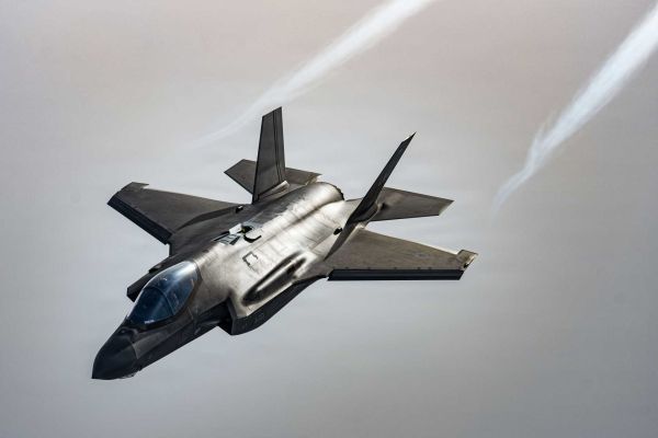 A U.S. Air Force F-35 Lightning II assigned to the 48th Fighter Wing flies over the North Sea during Exercise Point Blank on January 29, 2026. The Pentagon plans to add a Starshield-enabled Beyond Line of Sight satellite communications capability to the F-35 by 2031, allowing the fighter to exchange track data across extended distances for long-range kill-chain management.