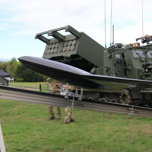 The jet-powered Nyan drone is displayed in front of a British Army M270A2 Multiple Launch Rocket System at DVD 2026, highlighting the growing integration of one-way attack drones with long-range artillery units to expand deep-strike options.