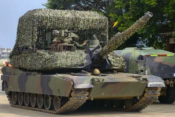 Taiwan is adapting its M1A2T Abrams tanks for drone-intensive warfare with camouflaged overhead protection, rapid field refueling, and dispersed operations designed to improve survivability under persistent aerial surveillance (Picture Source: China Times Group)