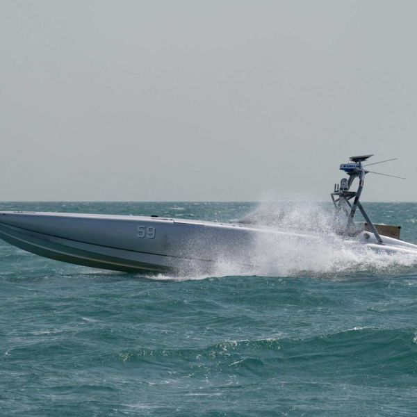 A U.S. Navy unmanned surface vessel equipped with an aerial missile system operates during Exercise Digital Talon 3.0 in November 2024. The Pentagon's new SWAP-USV Sprint 2 competition seeks production-ready autonomous boats capable of engaging hostile drones and helicopters using Hellfire, JAGM, APKWS, Stinger, or other mature weapons. (Picture source: U.S. Department of War/Defense)
