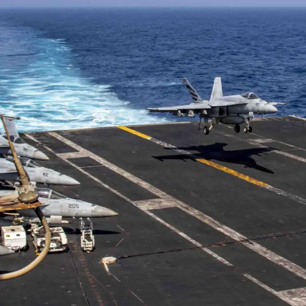 A U.S. Navy F/A-18E Super Hornet fighter jet assigned to Strike Fighter Squadron (VFA) 151 prepares for an arrested landing aboard the Nimitz-class aircraft carrier USS Abraham Lincoln (CVN 72) on June 2, 2026. Aircraft from Abraham Lincoln's Carrier Air Wing recently conducted a precision strike against the tanker M/T Marivex in the Gulf of Oman as part of U.S. blockade enforcement operations targeting maritime traffic bound for Iran.