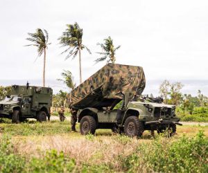 U.S. Marines operate an NMESIS battery equipped with Naval Strike Missile launchers during expeditionary training. The mobile anti-ship missile system is designed to support distributed sea-denial missions from dispersed coastal positions across the Indo-Pacific.