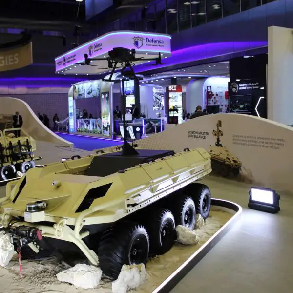 The Mission Master unmanned ground vehicle displayed by Barzan Holdings integrates a fully electric 8x8 UGV with a roof-mounted drone launch and recovery system, enabling mobile, low-signature patrols with persistent aerial surveillance, extended situational awareness, and networked control for base protection, border security, and forward reconnaissance missions (Picture source: Army Recognition Group).
