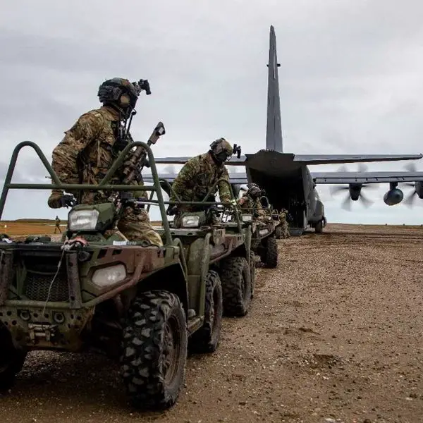 U.S. Army Green Berets from the 10th Special Forces Group load all-terrain vehicles onto a U.S. Air Force MC-130J Commando II during Operation POLAR DAGGER in Wales, Alaska, on August 17, 2024, demonstrating rapid Arctic infiltration and mobility near the Bering Strait.