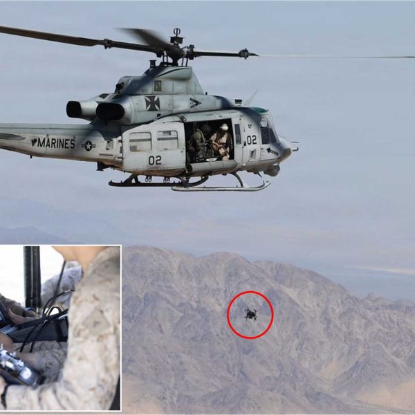U.S. Marines aboard a UH-1Y Venom from HMLA-169 deploy a first-person view (FPV) unmanned aerial system during an airborne integration exercise at the Marine Corps Air Ground Combat Center, Twentynine Palms, California.