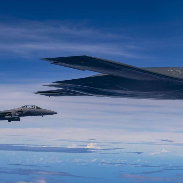 A U.S. B-2 Spirit firing LRASM alongside an F-15E over the Philippine Sea signals a sharper U.S. push to build long-range, stealth-enabled sea-denial power across the Indo-Pacific (Picture Source: U.S. Air Force)