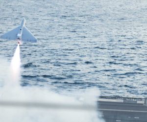 A LUCAS one-way attack drone launches from USS Santa Barbara during U.S. Central Command operations in the Arabian Gulf in December 2025. Falcon Strike will expand this concept into a multinational force combining aerial, surface and underwater attack systems.