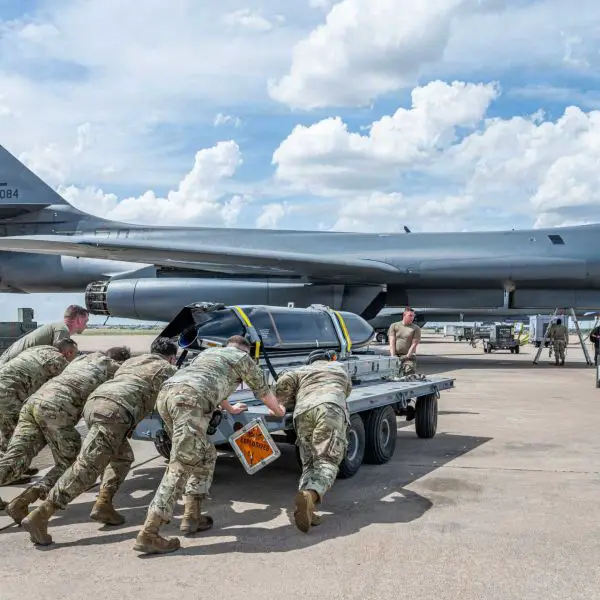 U.S. Airmen position a live AGM-158C LRASM near a B-1B Lancer during LRASM Event Zero at Dyess Air Force Base, Texas, on June 2, 2026. The event validated updated aircraft and missile software integration procedures.