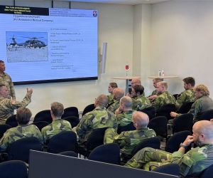 U.S. Army Lt. Col. Eric Fritz, commander of the New York Army National Guard’s 3rd Battalion, 142nd Assault Helicopter Battalion, briefs Swedish Air Force aviators on U.S. Army air assault doctrine at Malmen Air Base near Linköping, Sweden, on August 26, 2026. The training focused on the planning, coordination and survivability requirements needed to employ UH-60M Black Hawk helicopters for troop insertion in contested battlefield conditions.