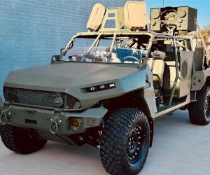 A U.S. Army M1301 Infantry Squad Vehicle fitted with the BlueHalo LOCUST high-energy laser weapon system is displayed during Fort Sill’s annual Fires Symposium in April 2025. The configuration highlights the Army’s effort to integrate mobile directed-energy counter-drone capabilities with maneuver formations. (U.S. Army photo)