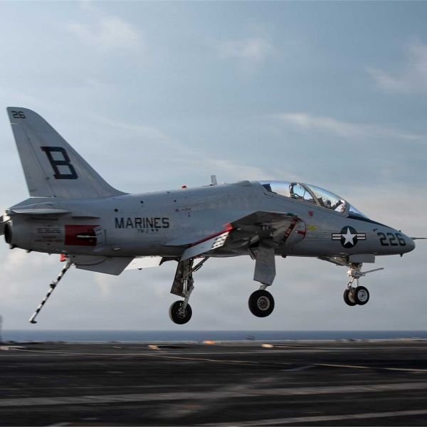 A U.S. Navy T-45C Goshawk advanced jet trainer approaches the flight deck of the Nimitz-class aircraft carrier USS Dwight D. Eisenhower (CVN 69) during carrier qualification operations in the Atlantic Ocean on June 27, 2026. (Picture source: U.S. Department of War/Defense)