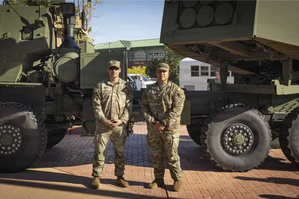 U.S. Army Sgt. 1st Class Matthew Nethers (left) and Sgt. 1st Class Nicolas Adame, assigned to Bravo Company, 1st Battalion, 10th Field Artillery Regiment, 4th Multi-Domain Task Force, stand in front of an M142 HIMARS rocket artillery system during the unit's activation ceremony at Fort Carson, Colorado, on October 8, 2026. (Picture source: U.S. Army)