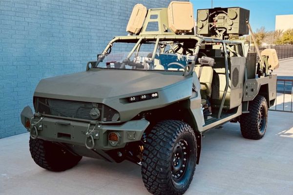 A U.S. Army M1301 Infantry Squad Vehicle fitted with the BlueHalo LOCUST high-energy laser weapon system is displayed during Fort Sill’s annual Fires Symposium in April 2025. The configuration highlights the Army’s effort to integrate mobile directed-energy counter-drone capabilities with maneuver formations. (U.S. Army photo)