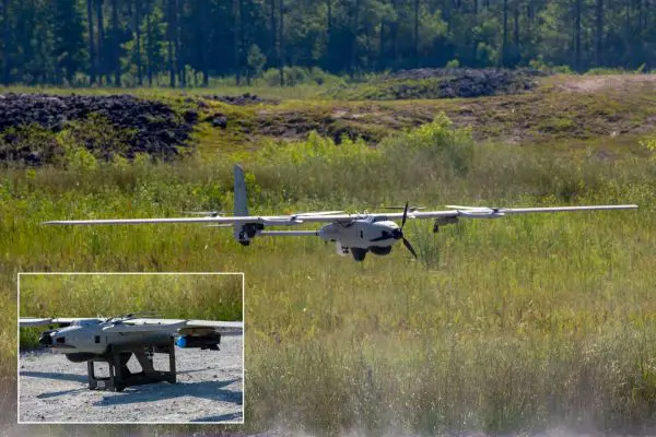 A VXE30 Stalker from the Small Unmanned Aircraft School lands after deploying a Neros Archer FPV drone during a live-fire test of lethal munitions at Camp Lejeune, North Carolina, on July 9, 2026, demonstrating its ability to integrate aerial strike capabilities and deploy FPV systems at the tactical level. (Picture source: US DoD)