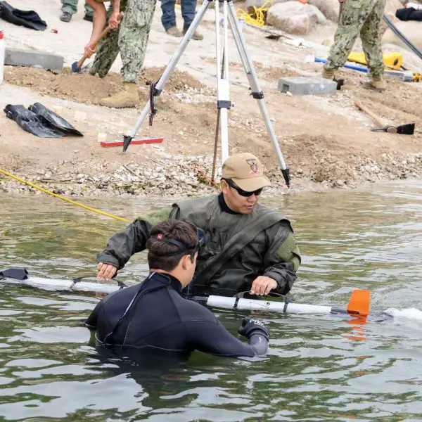 U.S. Navy personnel from Unmanned Undersea Vehicle Group (UUVGRU) 1 recover an Iver3 unmanned underwater vehicle during Exercise BALTOPS 2026 in Liepaja, Latvia, on June 8, 2026. The underwater drone supports NATO efforts to enhance undersea surveillance, mine countermeasure operations, and critical maritime infrastructure protection in the Baltic Sea. (Picture source: U.S. Department of War/Defense)