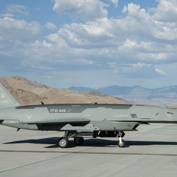 A U.S. Air Force YFQ-44A Fury assigned to the Collaborative Combat Aircraft Experimental Operations Unit undergoes weapon loading procedures on the flight line at Creech Air Force Base, Nevada, on July 21, 2026. (Picture source: US DoD)