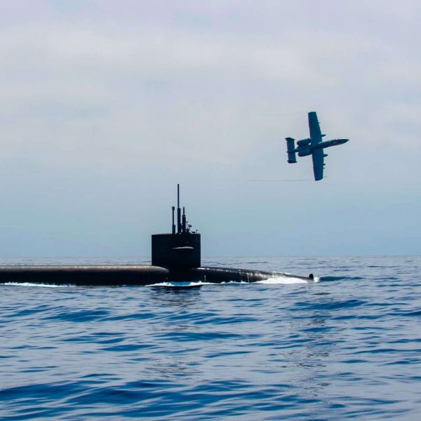 An A-10 Thunderbolt II provided armed overwatch for the Ohio-class ballistic missile submarine USS Nebraska during surfaced operations in the Pacific Ocean (Picture Source: U.S. Navy)
