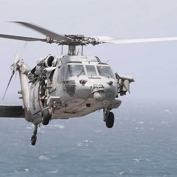 U.S. Navy MH-60R Seahawk armed with AGM-114 Hellfire missiles, illustrating the type of naval helicopter capability used by CENTCOM to intercept and disable the Panama-flagged cargo ship Vela Nova in the Gulf of Oman on August 11, 2026. The MH-60R can carry up to eight Hellfire missiles in a two-launcher configuration and combines maritime surveillance sensors with precision surface-strike capability.