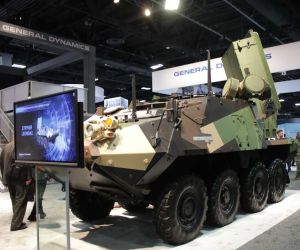 Epirus Leonidas high-power microwave weapon mounted on a Stryker armored vehicle during AUSA 2022, demonstrating a mobile counter-drone configuration designed to disable multiple unmanned aerial systems using directed electromagnetic energy.