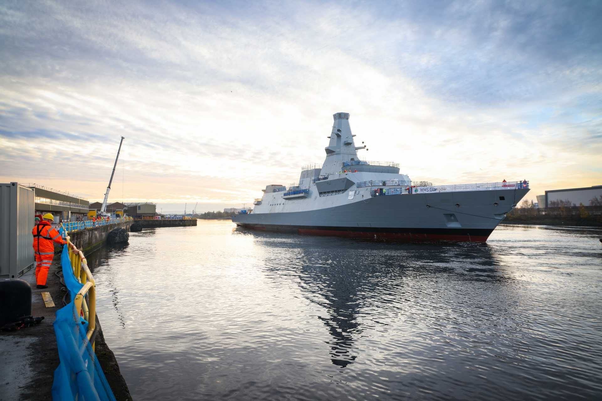Instead of a conventional slipway launch, the Type 26 frigate HMS Glasgow was transferred onto the semi-submersible barge CD01, moved down the Clyde to Glen Mallan, floated off and then returned to Scotstoun for final fitting-out. (Picture source: UK MoD)