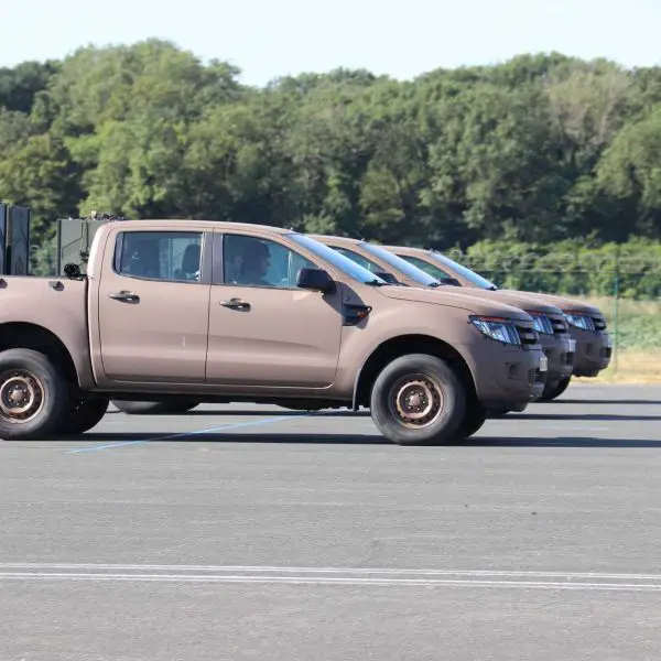 A Ford Ranger of the French Army's 1er Régiment d’Infanterie de Marine (1er RIMa) equipped with two rear-mounted launch containers, each carrying 10 FPV attack drones, was unveiled during the Bastille Day 2026 military parade rehearsal, marking the introduction of a new mobile swarm drone capability for front-line maneuver units. (Picture source: Army Recognition)