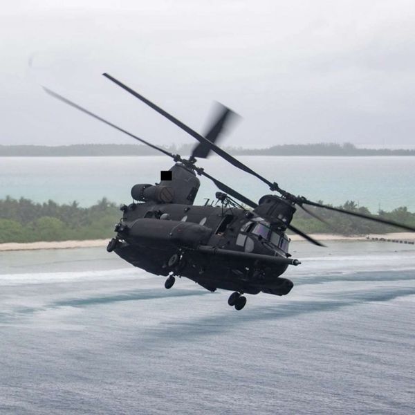 An MH-47G Chinook mounts crew-served 7.62 mm defensive guns, typically M134 miniguns forward and M240 machine guns aft, delivering high-volume suppressive fire to cover SOF insertions and extractions (Picture source: U.S. DoW).
